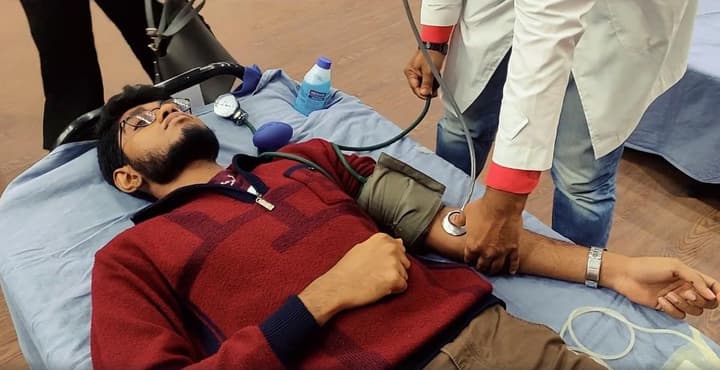 Blood donor receiving a health check before donation